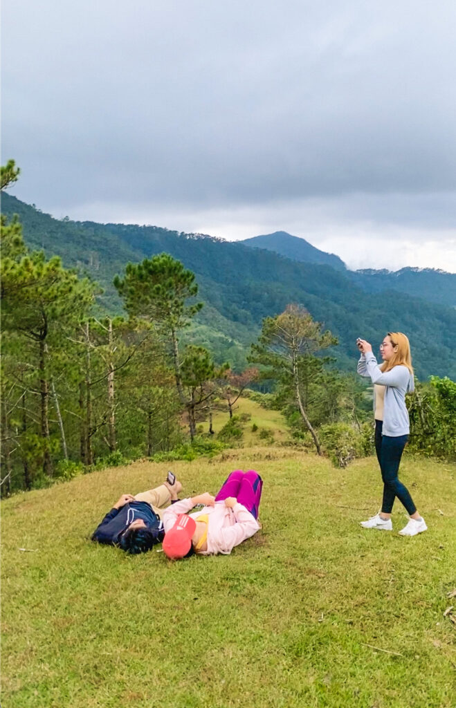My friends taking a photo at Mt. Ampacao in Sagada